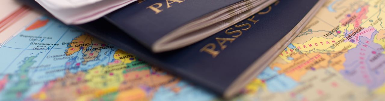 Passports on top of a world map