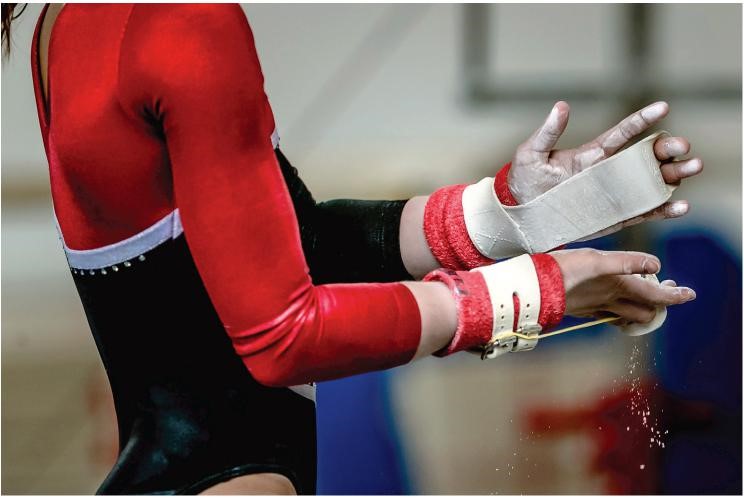 a collegiate gymnast warming up