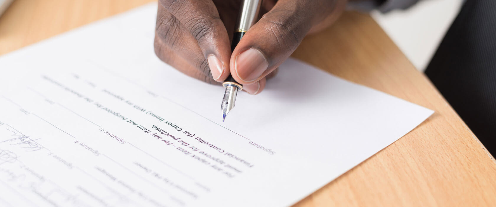 someone signing a contract